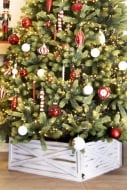 Traditional Christmas tree with white gold tree skirt