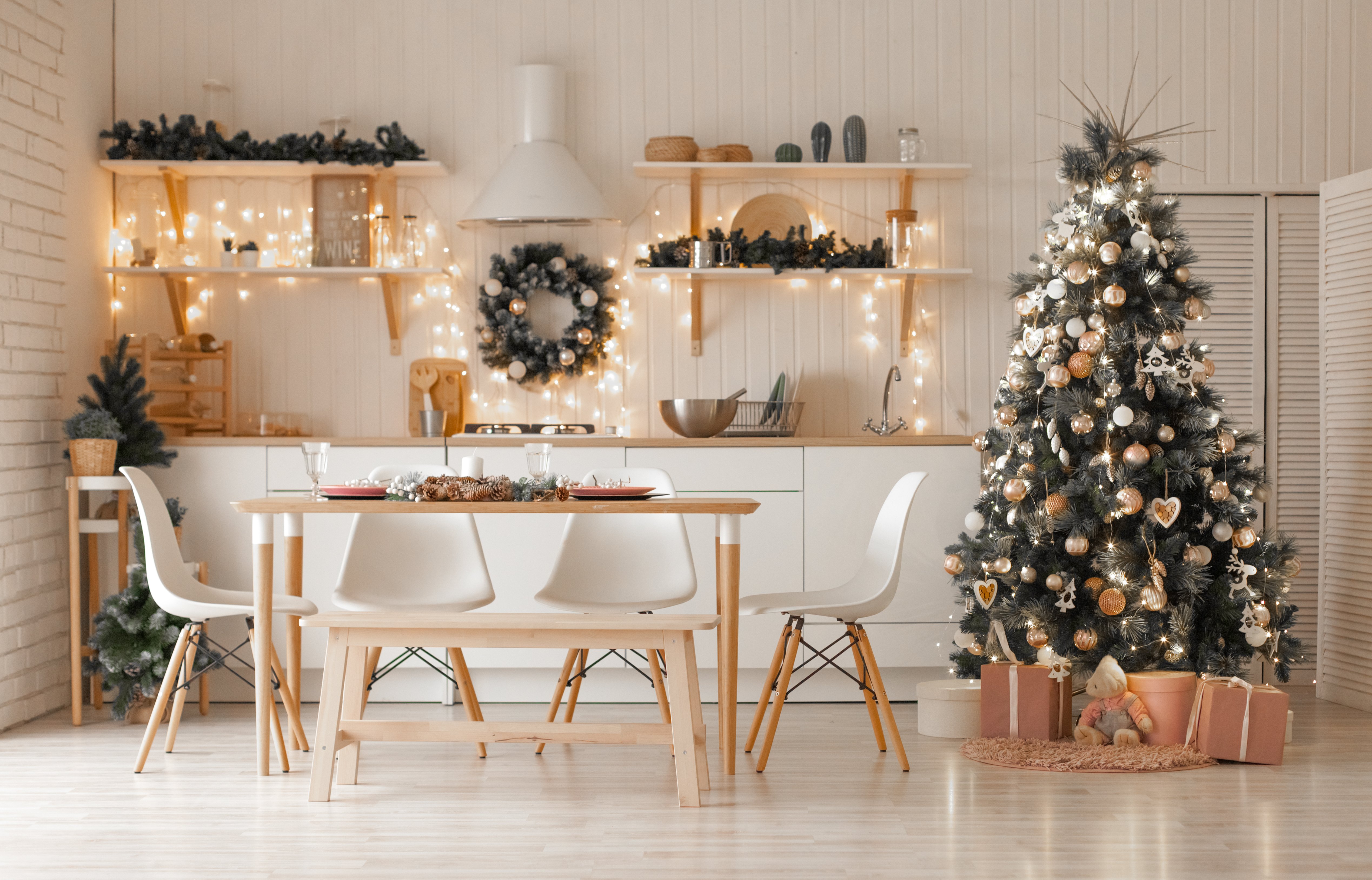 a modern christmas tree in a neutral, scandi-inspired kitchen