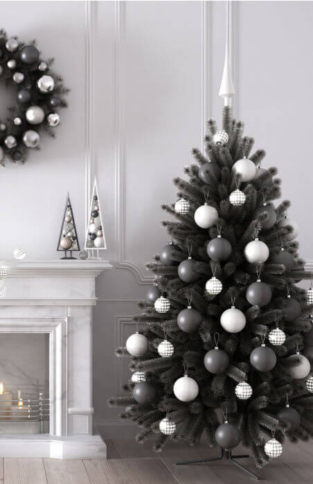 Black and white Christmas tree in minimalist Scandinavian style living roomn